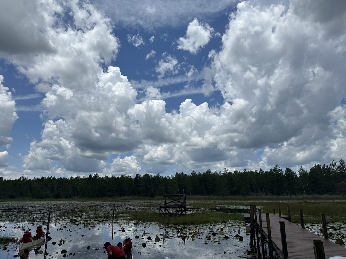 Lake with canoes at Kamp Khalil