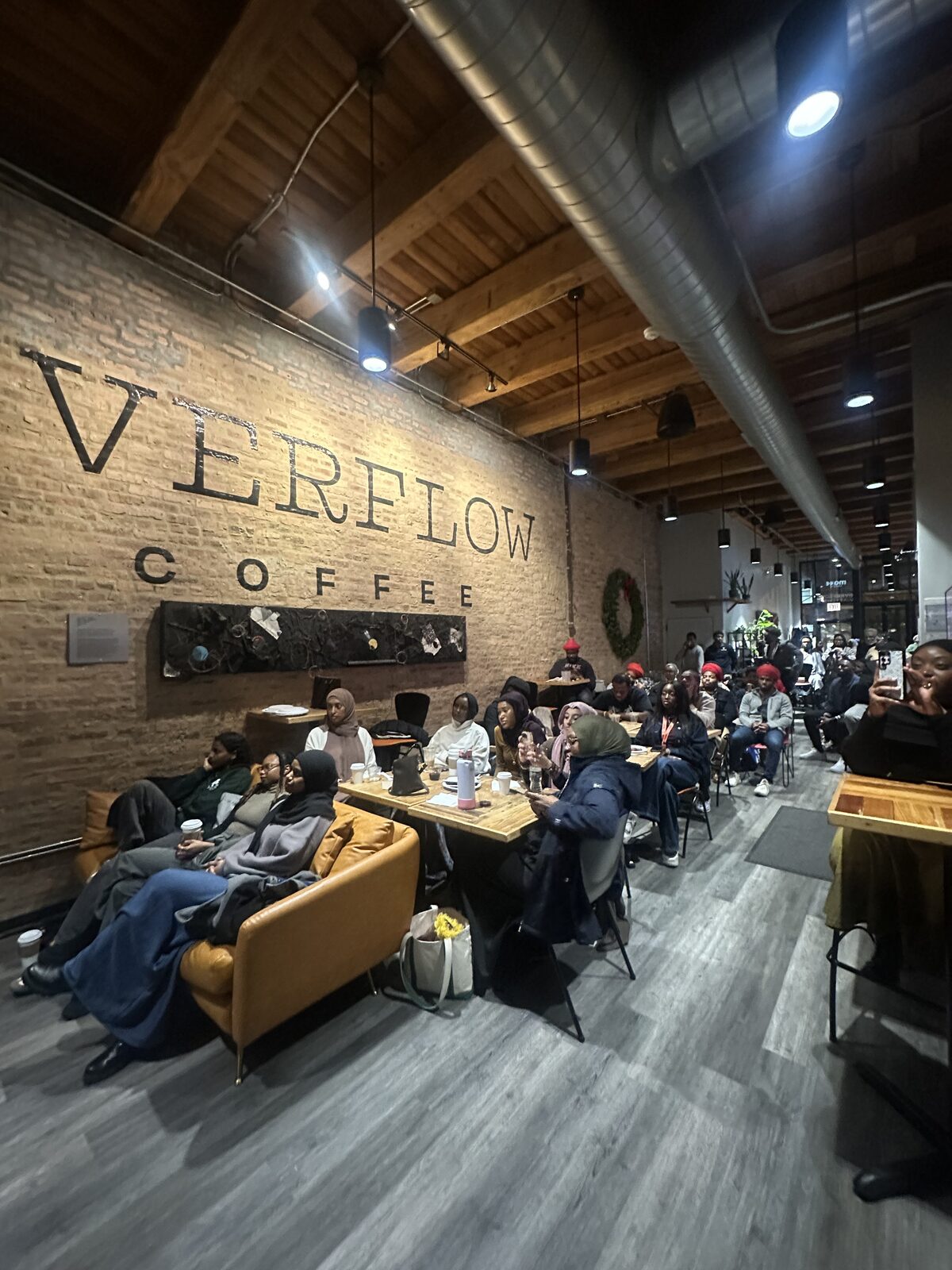Audience watching performance at Overflow Coffee