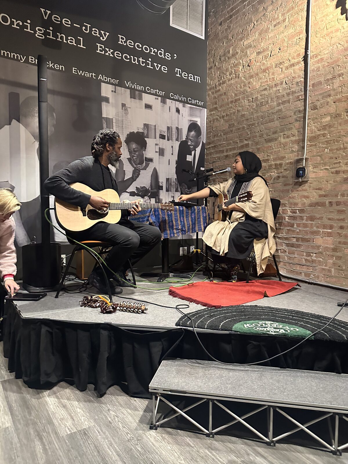 Musical duo performing on stage